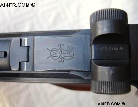 The photograph on the left is of the marking that is found on the front toggle link on this KGP-69 pistol.